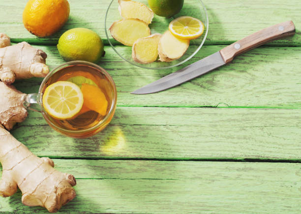 istock Ginger tea and ingredients on a  grunge wooden background 1021497880