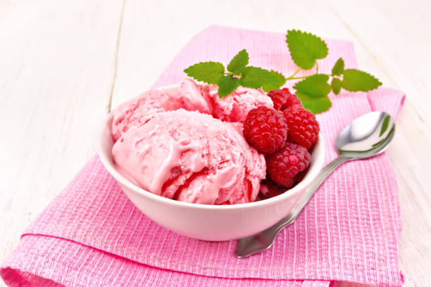 istock Ice cream crimson with mint in bowl on light board 1021508274