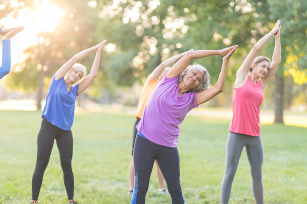 istock Co-ed fitness group exercising outside 1021511252