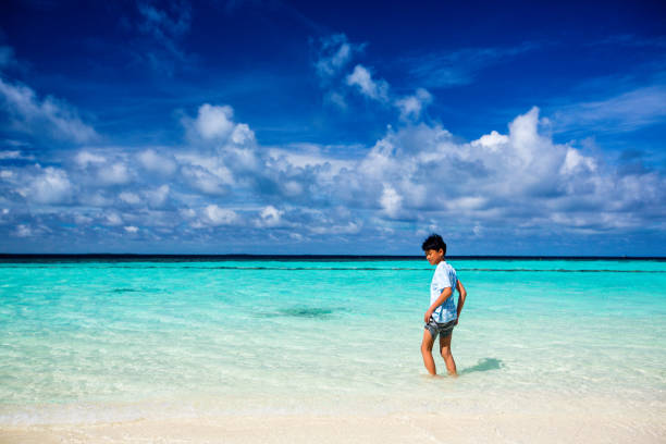 A young boy by the sea