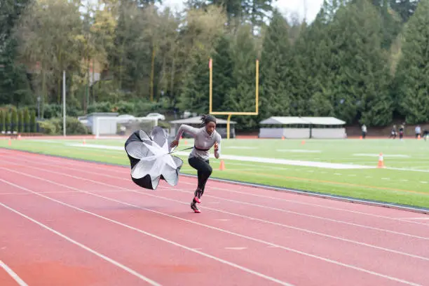 Photo of Female track athlete training at stadium