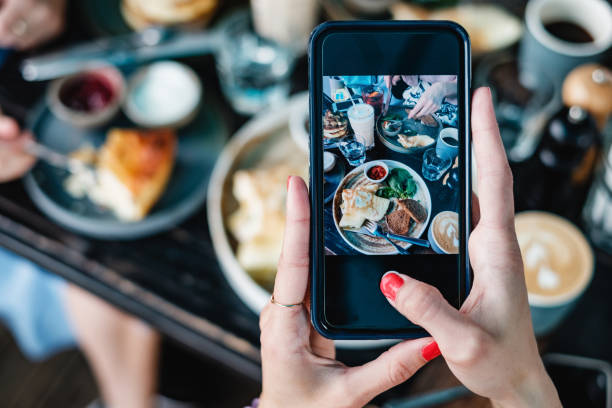 istock Taking food photo on mobile phone 1021521316