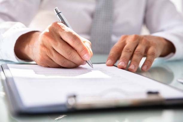 istock Businessman Filling Contract Form 1021542890