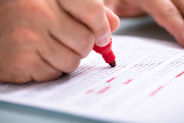 istock Businessperson Marking Error With Marker On Document 1021543238