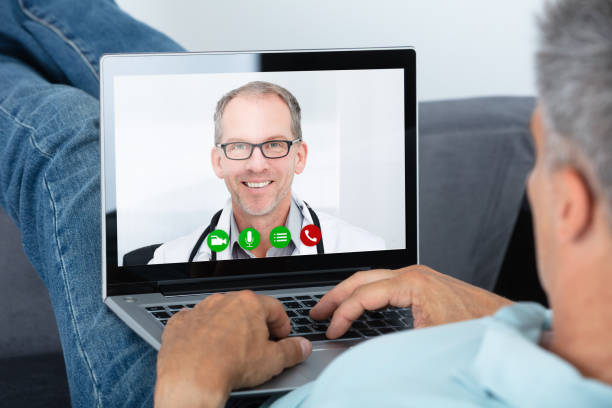 istock Man Videoconferencing With Doctor On Laptop 1021543462