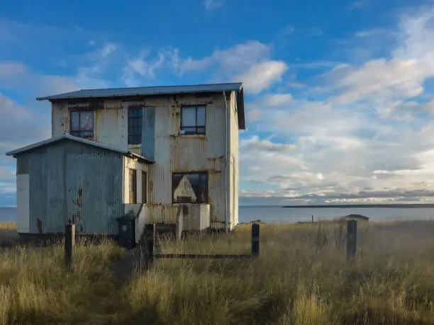 An abandoned house near a lake in the south of Iceland