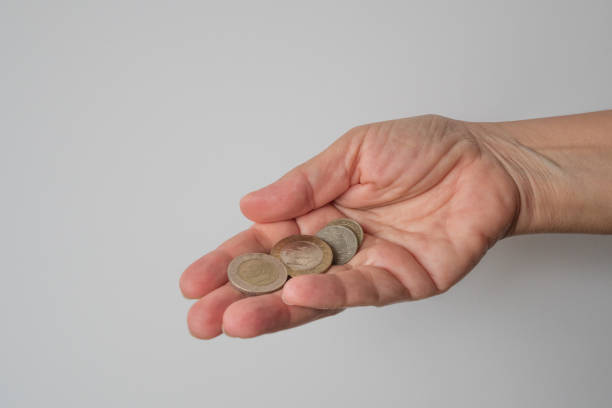 istock Turkish lira held on a gray background 1021552280