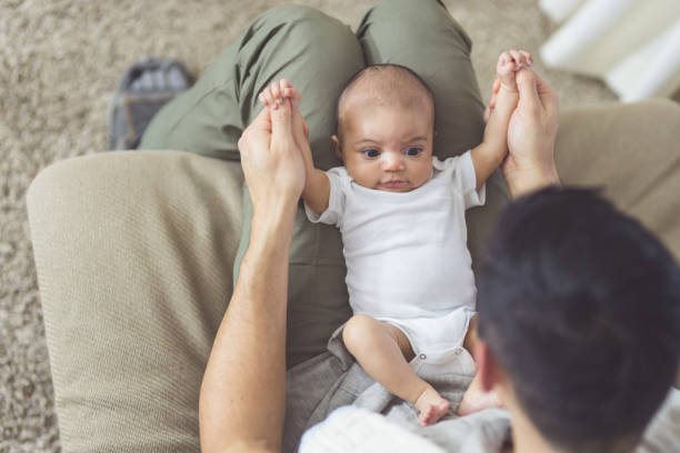 istock New dad holds his infant daughter 1021557024