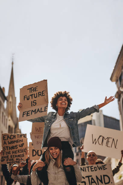 istock Female demonstrators enjoying the protest on road 1021562638