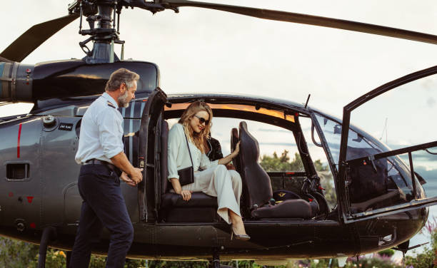 istock Beautiful woman travelling by her helicopter 1021562934