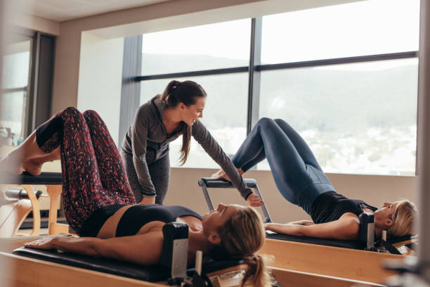 istock Pilates trainer instructing women at the gym 1021567928