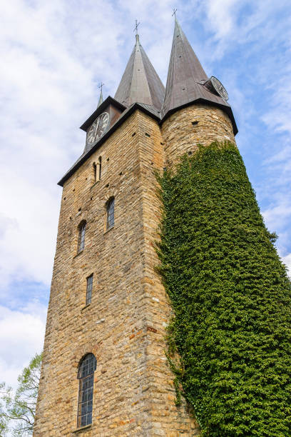 istock Church tower with climbing plant on the wall 1021577254