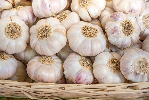 Stacked Garlic For Sale At Market Stall