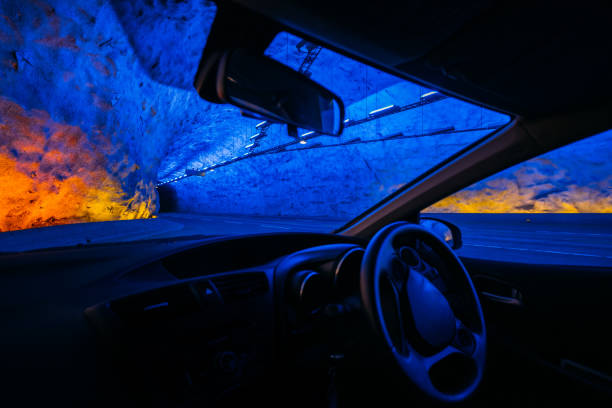 istock Road On Illuminated Tunnel In Norwegian Mountains. View From Car 1021586984