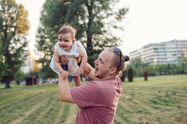 istock Daddy makes his baby girl fly 1021587030