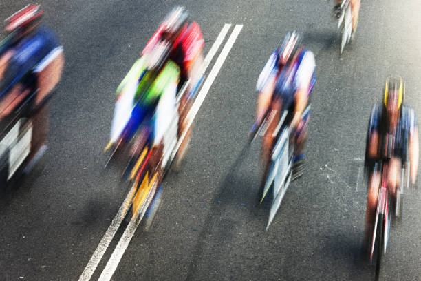 istock Cyclists riding at speed with motion blur 1021590486