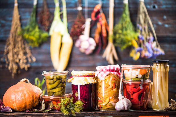 Pickled Marinated Fermented vegetables on shelves stock photo