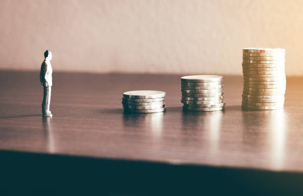 istock Miniature people looking future with stack coin about financial and money savings concept. 1021600178