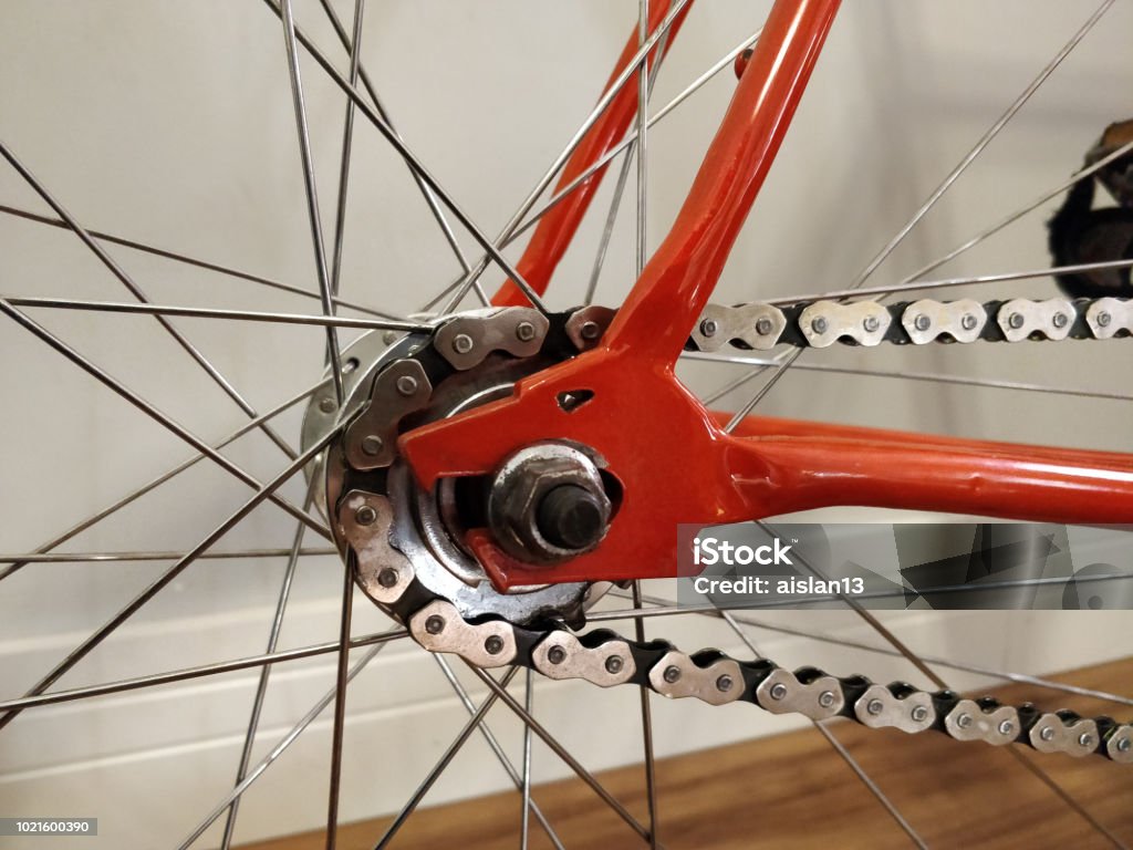 close up dropout fixie bike wolf orange bike, Bicycle Stock Photo