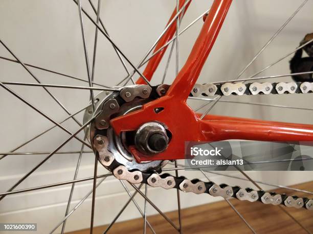 Close Up Dropout Fixie Bike Wolf Orange Bike Stock Photo - Download Image Now - Bicycle, Bicycle Chain, Bicycle Frame