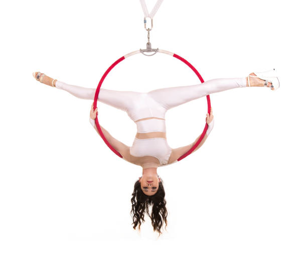 istock A young girl performs the acrobatic elements in the air ring. 1021602586