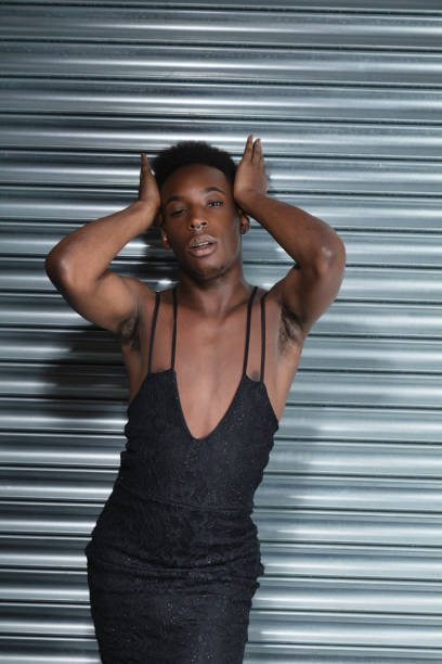 istock Cross dressing model in a black evening dress 1021605458