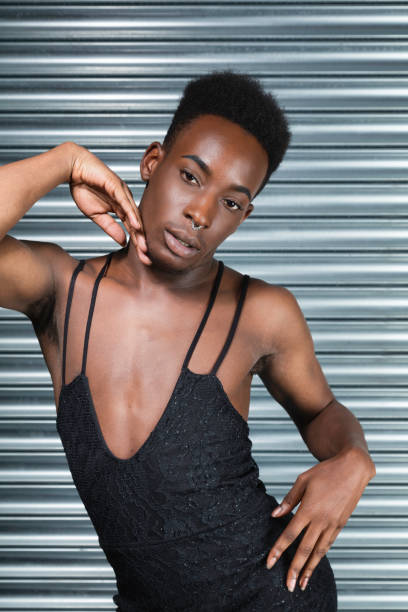 istock Cross dressing model in a black evening dress 1021608188
