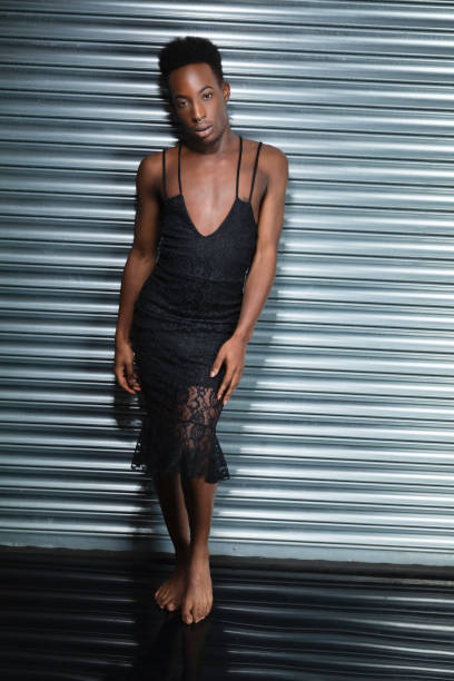 istock Cross dressing model in a black evening dress 1021608224