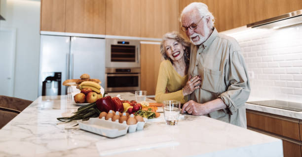 istock senior couple cooking in the kitchen 1021608504