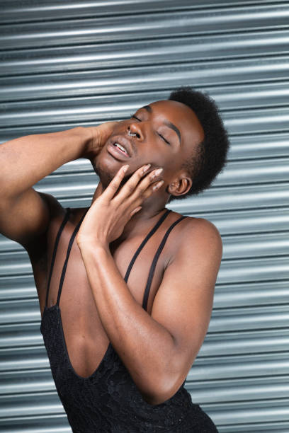 Cross dressing model in a black evening dress