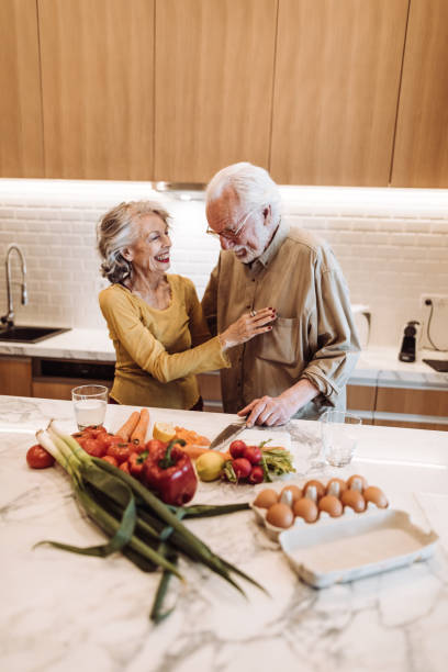 istock senior couple cooking in the kitchen 1021608668