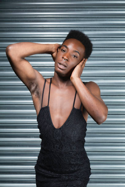 istock Cross dressing model in a black evening dress 1021608686