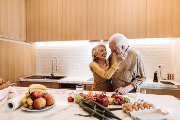 istock senior couple cooking in the kitchen 1021608700