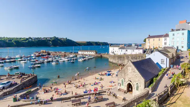 Panoroma of Tenby on a hot summer day, Wales, UK. A picturesque and colorful village on the coast of Wales.