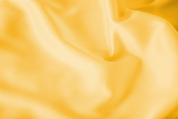 istock Smooth elegant shiny gold silk or satin luxury cloth texture can use as abstract holidays background. Luxurious Christmas background or New Year background design. 1021615684
