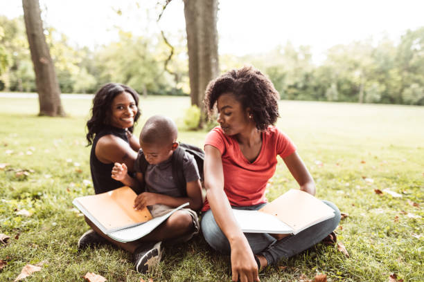 istock family doing the homework in the park 1021620250