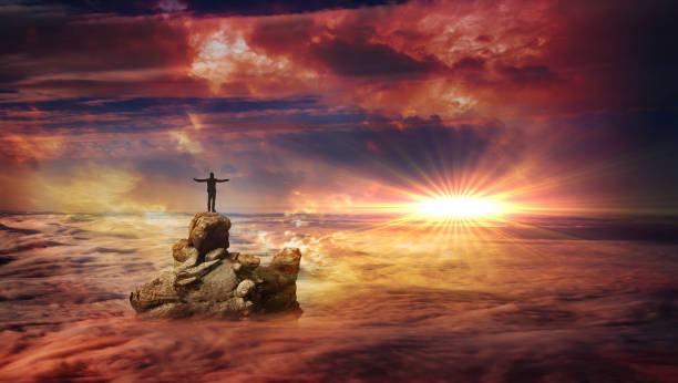 istock A man on a rock above the clouds 2 1021629496