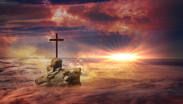 istock Cross on a rock above the clouds 2 1021629506