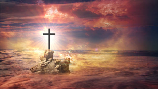 istock Cross on a rock above the clouds 3 1021631572