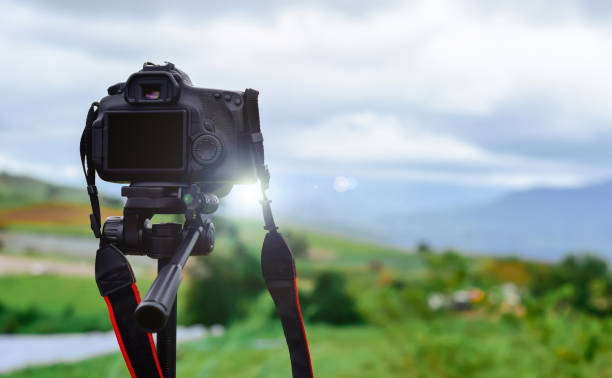 istock Camera on tripod Photographers take scenic views. 1021633804