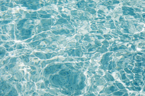 istock Sunlight and surface of a swimming pool 1021651082