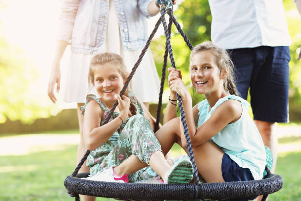 istock Joyful family having fun on playground 1021655998