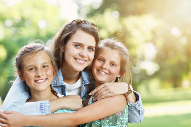 istock Young mom with children having fun in nature 1021656082