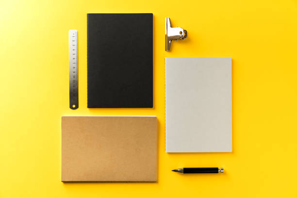 istock Black and white back to school accessories flat lay on yellow background. 1021656226