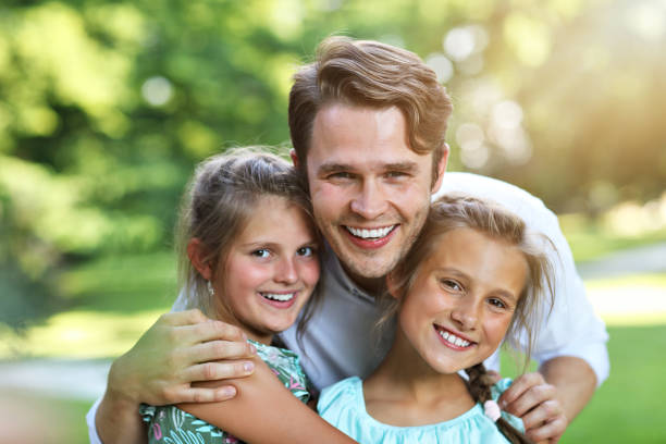 istock Young dad with children having fun in nature 1021656734