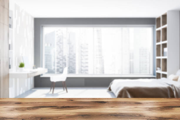 istock Gray bedroom interior, bookcases side view blur 1021673768