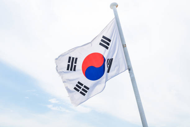 istock Korean flag with wind on white cloud 1021681172