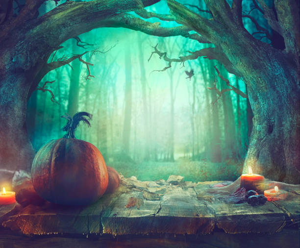 istock Halloween theme with pumpkins and dark forest. Spooky Halloween 1021685080