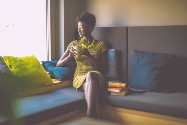 Young woman is taking a break in a cosy corner