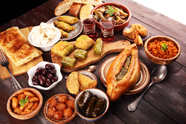 istock Middle eastern or arabic dishes and assorted meze, concrete rustic background. sambusak. Turkish Dessert Baklava with pistachio. Sarma. Halal food. Lebanese 1021688332